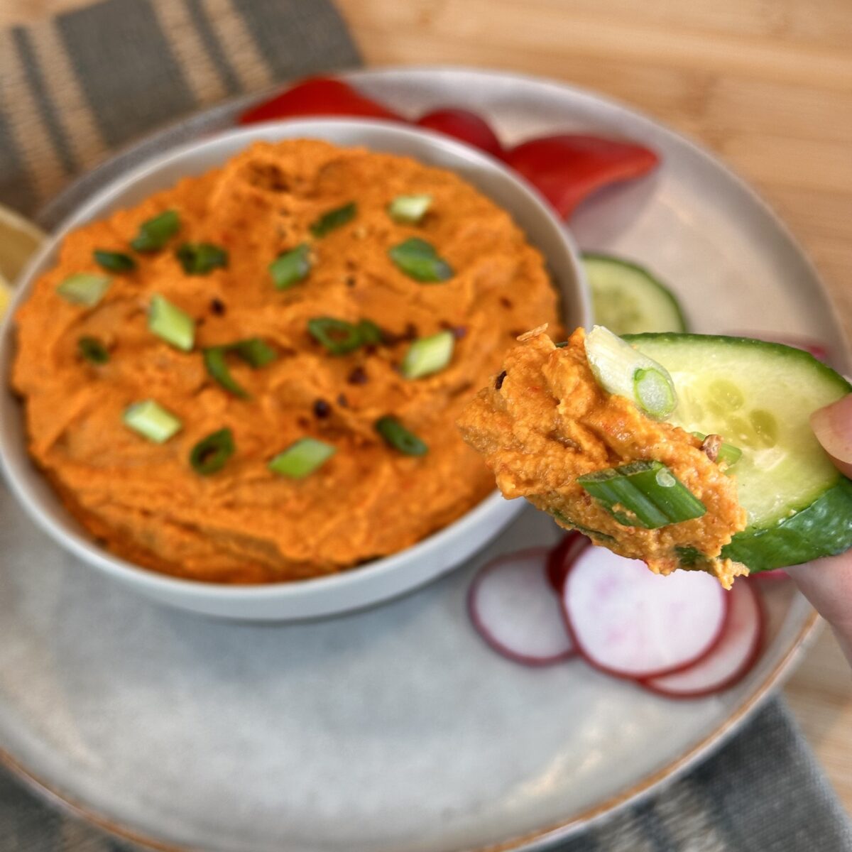 roasted red pepper hummus on cucumber plated